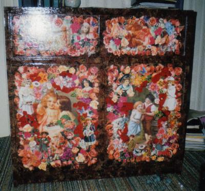 decorated doll house cabinet with decoupage on the doors